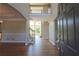Grand foyer featuring gleaming hardwood floors, a soaring two-story ceiling, and an elegant staircase at 5029 Preservation Pointe, Kennesaw, GA 30152