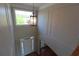 Entryway with a pendant light fixture, natural light, hardwood floors, and trimmed walls at 5029 Preservation Pointe, Kennesaw, GA 30152