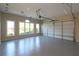 Spacious garage with windows, offering ample lighting and a convenient garage door opener system at 5029 Preservation Pointe, Kennesaw, GA 30152