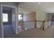 Second floor hallway with views of the downstairs entryway and additional rooms at 5029 Preservation Pointe, Kennesaw, GA 30152