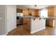 Well-lit kitchen with modern stainless steel appliances and center island with bar at 5029 Preservation Pointe, Kennesaw, GA 30152