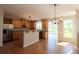 Bright kitchen features wooden cabinets, stainless appliances, and hardwood floors at 5029 Preservation Pointe, Kennesaw, GA 30152