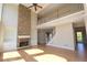 Bright living room boasts hardwood floors, fireplace with stone surround, and built-in shelving at 5029 Preservation Pointe, Kennesaw, GA 30152