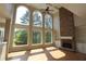 Bright living room features hardwood floors, a stone fireplace, and scenic views at 5029 Preservation Pointe, Kennesaw, GA 30152