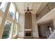 Elegant living room with stone fireplace, hardwood floors, and large windows at 5029 Preservation Pointe, Kennesaw, GA 30152