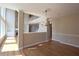 Open concept living room boasts hardwood floors, natural light, and an open floor plan at 5029 Preservation Pointe, Kennesaw, GA 30152