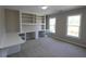 Office space with built-in shelving and desk area and two windows at 5029 Preservation Pointe, Kennesaw, GA 30152