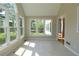Bright sunroom with tile flooring and large windows offering lovely green views at 5029 Preservation Pointe, Kennesaw, GA 30152
