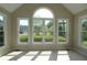 Sunroom with tile floors, large windows providing great neighborhood views, and a vaulted ceiling at 5029 Preservation Pointe, Kennesaw, GA 30152
