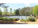 Community tennis courts with benches and manicured landscaping at 5029 Preservation Pointe, Kennesaw, GA 30152
