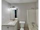 Updated bathroom with large mirror, modern vanity, and shower-tub combo at 64 Little John Way, Douglasville, GA 30134