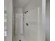 Modern shower with built-in shelving and sleek fixtures at 64 Little John Way, Douglasville, GA 30134