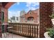 Cozy balcony with views of the city skyline and neighboring brick building; perfect for outdoor relaxation at 77 Peachtree Ne Pl # 608, Atlanta, GA 30309