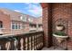 Charming balcony with brick surroundings, offering a tranquil outdoor space with decorative potted plants at 77 Peachtree Ne Pl # 608, Atlanta, GA 30309