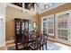 Elegant dining room with hardwood floors, chandelier, and lots of natural light at 77 Peachtree Ne Pl # 608, Atlanta, GA 30309