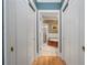 Hallway leading to bathroom with tile flooring and storage closets at 77 Peachtree Ne Pl # 608, Atlanta, GA 30309