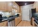 Well-lit kitchen with granite countertops and stainless steel appliances at 77 Peachtree Ne Pl # 608, Atlanta, GA 30309