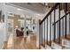 Elegant living room with a fireplace, beautiful hardwood floors, and grand design at 77 Peachtree Ne Pl # 608, Atlanta, GA 30309
