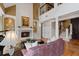 Elegant living room featuring fireplace, piano, and hardwood floors at 77 Peachtree Ne Pl # 608, Atlanta, GA 30309