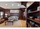 Cozy seating area features hardwood floors, dark wood trim, and built-in bookcases for functional style at 77 Peachtree Ne Pl # 608, Atlanta, GA 30309