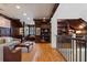 Upstairs living room features hardwood floors, dark wood trim, and built-in shelving for a sophisticated look at 77 Peachtree Ne Pl # 608, Atlanta, GA 30309