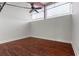 Bright bedroom with hardwood floors, ceiling fan and exposed pipes at 1261 Caroline Street Ne # 206, Atlanta, GA 30307