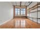 Open floor plan with wooden shelving and flooring; windows with natural light at 1261 Caroline Street Ne # 206, Atlanta, GA 30307
