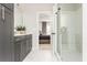 Well-lit bathroom with modern vanity, glass shower, and bedroom access providing a convenient and luxurious experience at 1371 Walking Way, Atlanta, GA 30316