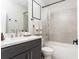 Modern bathroom boasts sleek vanity with white marble countertop and a shower-tub combination at 1371 Walking Way, Atlanta, GA 30316
