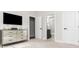 Bedroom features a mirrored dresser and attached bathroom with white doors and dark hardware at 1371 Walking Way, Atlanta, GA 30316