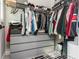 Walk-in closet with ample storage featuring hanging rods, shelving, and drawer units for organized living at 1371 Walking Way, Atlanta, GA 30316