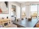 Dining area with stylish light fixture, dog kennel furniture, and a view to the yard at 1371 Walking Way, Atlanta, GA 30316