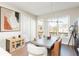Bright dining room with modern light fixture and access to outdoor space at 1371 Walking Way, Atlanta, GA 30316