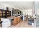 Open-concept dining room flows from kitchen with stylish furnishings and decor at 1371 Walking Way, Atlanta, GA 30316