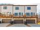 View of the townhouse-style homes boasting attached garages and charming wooden decks perfect for relaxing outdoors at 1371 Walking Way, Atlanta, GA 30316