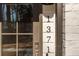 Close-up of a modern, vertical house number next to the front door for easy visitor identification at 1371 Walking Way, Atlanta, GA 30316