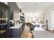 Modern kitchen flows to the living room; features include marble counters and stainless appliances at 1371 Walking Way, Atlanta, GA 30316