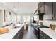 Stylish kitchen with marble counters, gray cabinets, stainless appliances, and eat-in breakfast area at 1371 Walking Way, Atlanta, GA 30316
