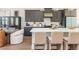 Modern kitchen with gray cabinets, stainless steel appliances, and a spacious island at 1371 Walking Way, Atlanta, GA 30316