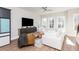 Stylish living area with a comfortable sofa, modern décor, and ample natural light from three large windows at 1371 Walking Way, Atlanta, GA 30316