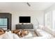 Living room with modern décor, including a wall-mounted TV, floating cabinet, and stylish seating at 1371 Walking Way, Atlanta, GA 30316