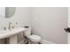 Simple powder room with pedestal sink, modern faucet, and updated plumbing fixtures at 1371 Walking Way, Atlanta, GA 30316