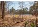 Scenic view of a well-maintained community tennis court surrounded by lush trees, offering a great recreational amenity at 1371 Walking Way, Atlanta, GA 30316