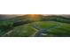 Panoramic aerial view of new home construction site surrounded by beautiful, mature trees on a sunny day at 235 Laurel Vista Dr, Canton, GA 30114