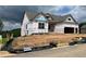 New home construction featuring a modern design, large windows, and an attached two-car garage at 235 Laurel Vista Dr, Canton, GA 30114