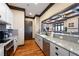 Modern kitchen featuring granite countertops, stainless steel appliances, and sleek white cabinetry at 235 Laurel Vista Dr, Canton, GA 30114