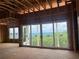 Unfinished room with large windows showcasing mountain views at 235 Laurel Vista Dr, Canton, GA 30114