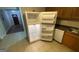 Kitchen with tile floors, and white refrigerator at 2391 Randall Ave, Lithonia, GA 30058