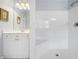 A bright bathroom featuring a glass-door shower and single sink vanity at 295 River Laurel Way, Woodstock, GA 30188