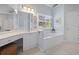A full bathroom with a soaking tub, dual vanity and linen closet at 295 River Laurel Way, Woodstock, GA 30188